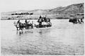 Co. B~ 10th Infantry~, crossing Gila River in buckboard wagons near San Carlos, Ariz. Terr., ca. 1885 - NARA - 530931.jpg