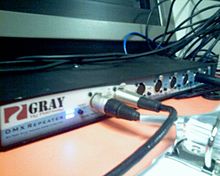 A DMX splitter/buffer. It allows a DMX universe from one source to be repeated to several chains of devices, in order to avoid signal degradation due to long cable runs. Dmx repeater.jpg