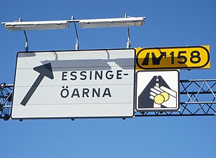 Avfart "Essingeöarna" nr 158 och trängselskattmärket.