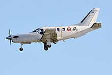 A French Air and Space Force TBM 700. Note the small door aft of the wing. French Air Force, F-RAXL, Socata TBM700 (27881367003).jpg