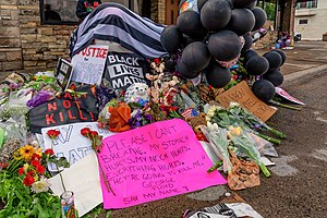 Tribute items left at site of Floyd's murder forming a makeshift memorial