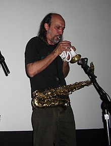 Photo of Mexican musician Germán Bringas playing a saxophon