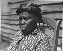 Original caption of 1941 photograph: "Harmony Community, Putnam County, Georgia...This old woman was a slave and belonged to the family on whose place she now lives. She was a small girl when Sherman's army came through." (U.S. Department of Agriculture via NARA) Harmony Community, Putnam County, Georgia.... This old woman was a slave and belonged to the family . . . - NARA - 521368.jpg