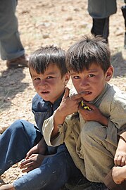 Hazara children in the remote province of Daykundi enjoy candy.