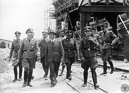 Heinrich Himmler (second left) visits the IG Farben plant in Auschwitz III, July 1942.