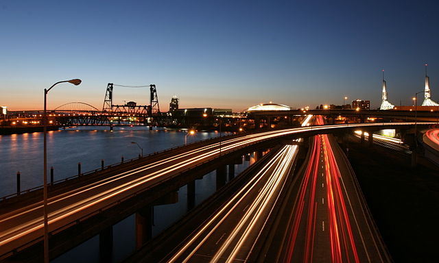 I-5 running adjacent to the Willamette River and passes by the Moda Center, and Oregon Convention Center in Downtown Portland