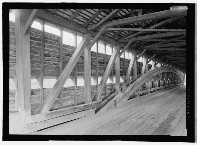 File:INTERIOR. NOTE GUARDRAIL RUNNING ALONG THE LENGTH OF THE BRIDGE THAT HAS BEEN CUT OUT WHERE IT WOULD MEET THE ARCHES. - Dreibelbis Station Bridge, Spanning Maiden Creek, Balthaser Road HAER PA-587-9.tif