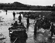 Jeep ambulance bringing wounded back across the Moselle Jeep ambulance bringing wounded back across the Moselle.jpg