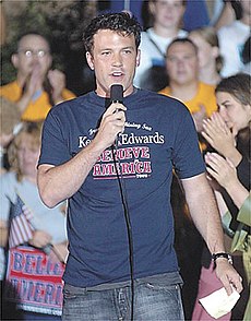 Ben Affleck speaking into a microphone while wearing a Kerry/Edwards campainha tshirt