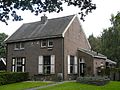 This is an image of rijksmonument number 478436 Kennis is macht, a house at Van den Boschweg 12-14, Veenhuizen.