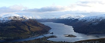 Loch Duich from the north-west, with Eilean Donan Castle (middle foreground), Loch Long (left foreground), Loch Alsh (right foreground), and the mountains of Glen Shiel (centre background) Kint.jpg