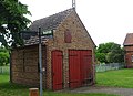 Fire station with hose mast