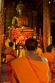 Laos - Luang Prabang 83 - young monk at afternoon prayer (6582317419).jpg