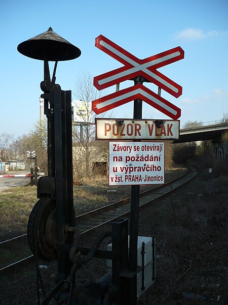 File:Level crossing in Jinonice with boom barrier permanently down sign.jpg