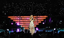 Carey performing "Hero" live during her Charmbracelet World Tour (2002-2003) Mariah Carey 2003 tour 1.jpg