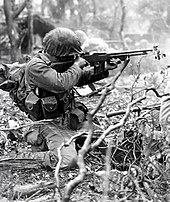 A US Marine Corps infantryman firing a BAR at enemy positions Marine BAR shooting NA01862.jpg