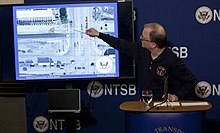 NTSB Board Member Robert Sumwalt briefs media in February 2015 Member Sumwalt describing the accident scene (16475225368).jpg