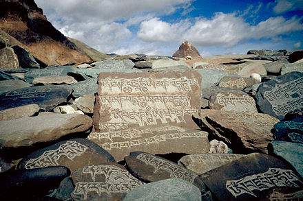 Carved mani stones, each with "Om Mani Padme Hum" on a pathway in Zangskar