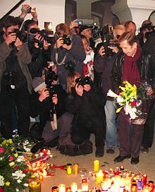 21st anniversary of the Velvet Revolution - former President Vaclav Havel (right, with flowers) at the Memorial at Narodni Street in Prague Narodni trida (2010).jpg