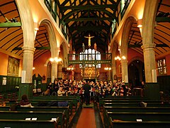 Nave with choir practice, St Michael and All Angels, Bedford Park