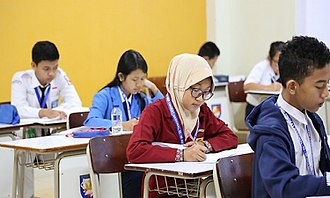 Junior high school participants sitting a theoretical exam Osn students 2017.jpg