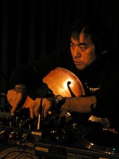 A man manipulating electronic instruments.