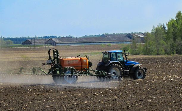 Tractor with pesticide sprayer in Estonia