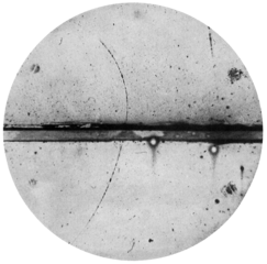 Curved arc shows a cloud chamber trajectory of a positron