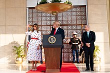 President Donald Trump and First Lady Melania Trump with Ambassador Kenneth Juster at the U.S. Embassy in New Delhi in 2018 President Trump and the First Lady in India (49609323811).jpg