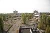 The central square of Pripyat as of 2008. In 22 years, vegetation had grown through the concrete.