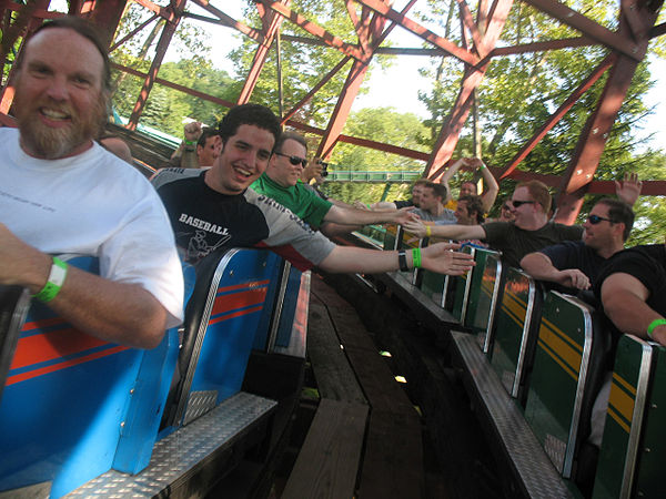 Riders slap hands on the Racer at Kennywood