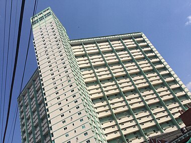 Rear elevation showing tower apartments, tenant and service corridors.