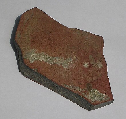 Roman roof tile fragment (78 mm wide by 97 mm high) found in York, England, with the impression of a kitten's paw