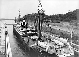 The first ship to transit the canal, the SS Ancon, passes through on 15 August 1914