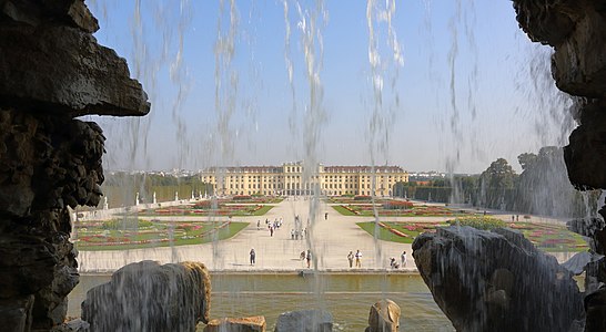 Schönbrunn Palace in Vienna, Austria, as seen through Neptune Fountain