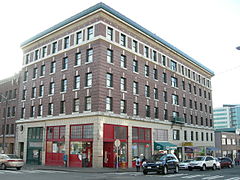 Alps Hotel building, 621 S King St, on the corner of Maynard Ave S