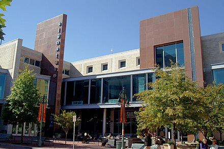 Exterior of Signature Theatre above the Shirlington Library. The doors to the library are on the right, the theater entrance on the left. The lobby is behind the 14' high by 140' long second floor glass wall