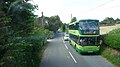 English: Southern Vectis 1101 Whale Chine (HW08 AOP), a Scania OmniCity, in Chale Street, Chale, Isle of Wight, on route 6. It is pausing beside the Old Rectory bus stop, waiting for our bus, another route 6 going the other way, to get out of the narrow section. When the photo was taken, one bus of the two on route 6 is meant to be run with a Mini Pointer Dart if one is availble. Clearly, in this case, it was not, as both vehicles are double-deck.