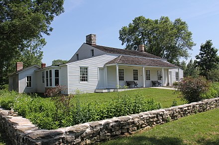 Built in 1776 by French-Canadian voyageur Joseph Roi, the Tank Cottage is the oldest standing building from the state's early years. Originally located on 8th Street along the Fox River, the cottage was moved to Heritage Hill State Historical Park in neighboring Allouez and is listed on the National Register of Historic Places.[17]