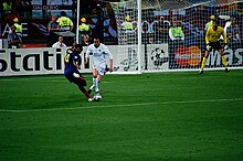 Henry taking on Manchester United defender John O'Shea. In his prime, Henry would often drift out to the left wing position and run towards goal. Thierry Henry vs John O'Shea, 2009 UEFA Champions League Final.jpg