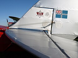Fabric covering of a de Havilland Tiger Moth showing rib stitching and inspection rings. TigerTail.JPG