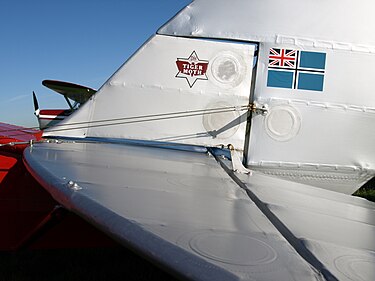 Fabric covering of a de Havilland Tiger Moth showing rib stitching and inspection rings. TigerTail.JPG