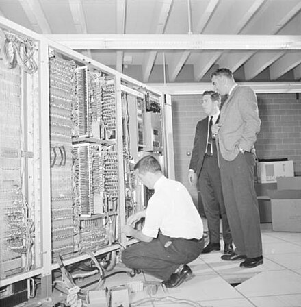 Wes Graham (right) with an IBM computer, Waterloo was one of the first universities in North America to establish a department of computer science.