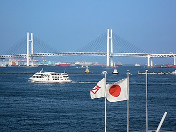 Yokohama City (left) and the Hinomaru (center) flying on Yokohama Harbor.