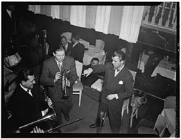 Tony Parenti, Wild Bill Davison, and Eddie Condon take a break at Eddie Condon's of New York City in June 1946 (Portrait of Tony Parenti, Wild Bill Davison, and Eddie Condon, Eddie Condon's, New York, N.Y., ca. June 1946) (LOC) (4932357596).jpg