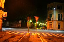 Crossroad in Alessandria, Italy: luminaires with mercury lamps are in the background, LED street lights in the middle, luminaires with high pressure sodium lamps are in the foreground. 110213 LED vs Sodium vs Mercury.jpg