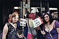 Activists at 2010 Rome Gay Pride advocate for condoms as way to save lives. The other banner is an Italian flag that reads ”No Vatican - [I'm] Free and Secularist.”