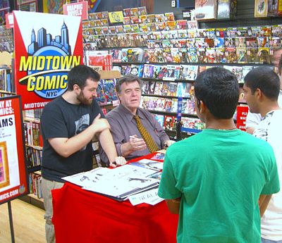 Adams with his son Josh at a signing for Batman: Odyssey #1 at Midtown Comics Times Square, July 10, 2010
