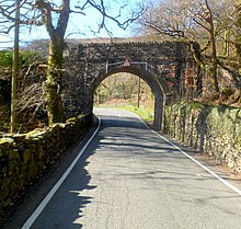 This bridge at Beddgelert was built for the Portmadoc, Beddgelert and South Snowdon Railway but never carried trains A498 bridge, Beddgelert - geograph.org.uk - 3217139.jpg