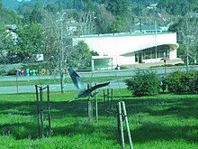 A heron flies by the Marin Post Office in Santa Venetia